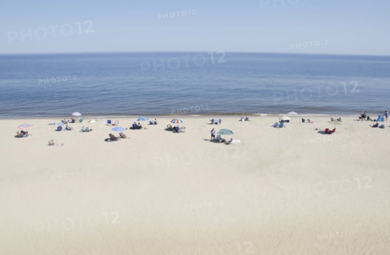 People relaxing on beach