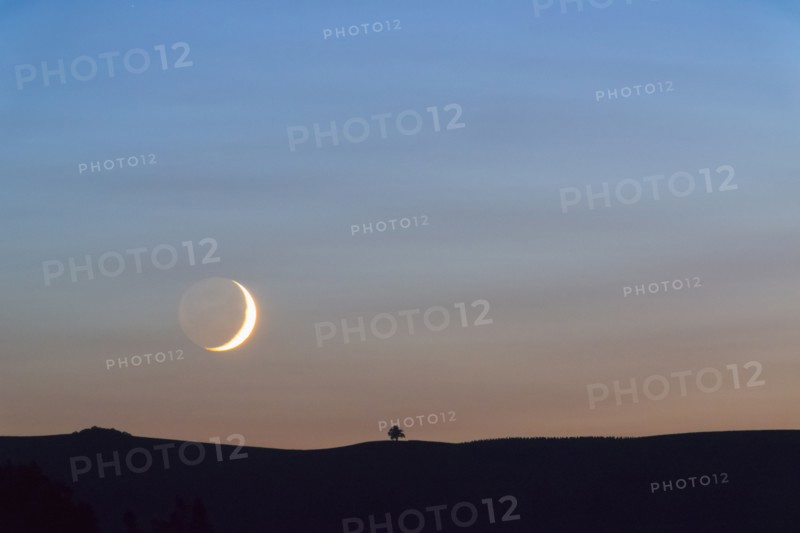 Moon on sky at sunset