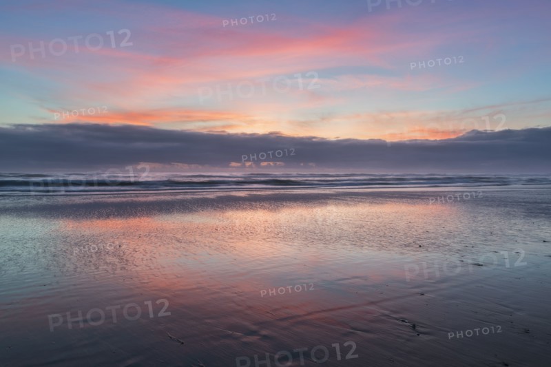 Sky reflecting in water at sunset