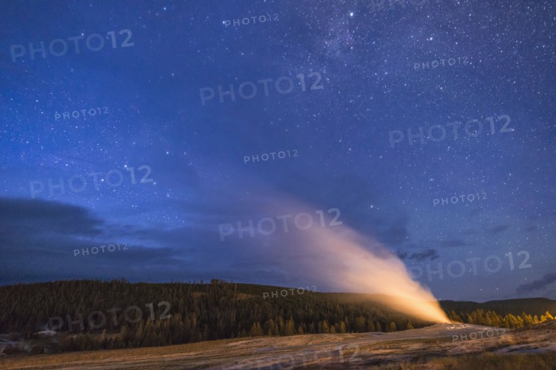 Geyser erupting at night