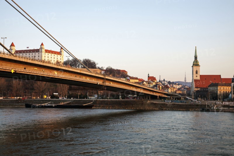 Bridge over water with city in background