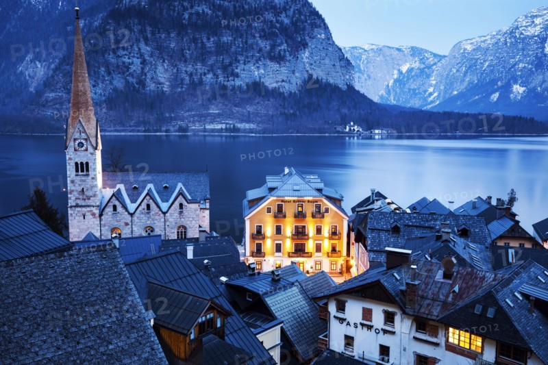 Town with lake and mountains in background