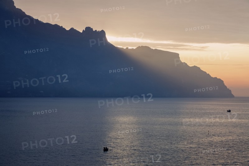 Silhouette of coastline at sunrise