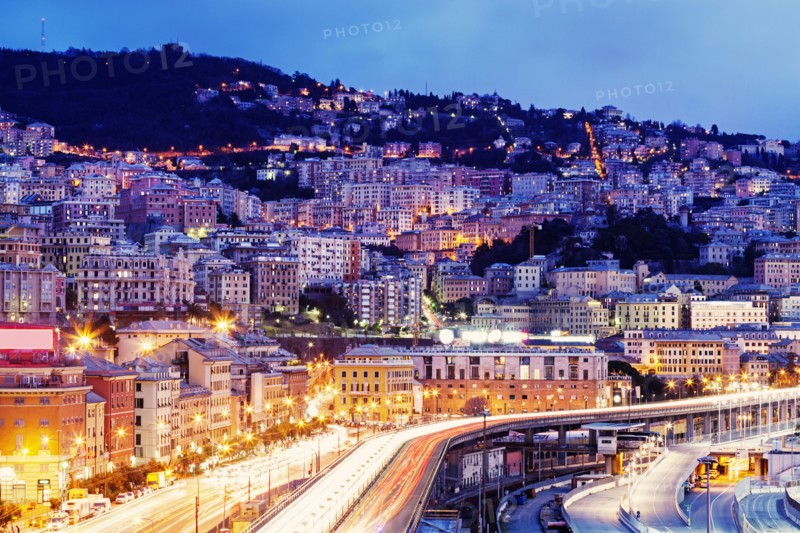 Highway along illuminated city