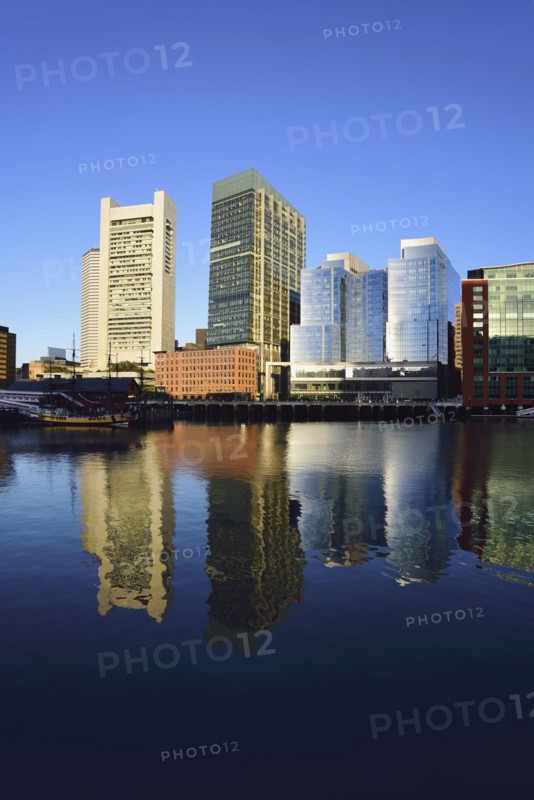 City waterfront reflected in Fort Point Channel