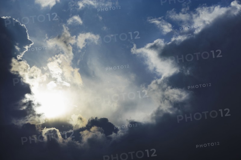 Dramatic sky, clouds and sun trying to break through