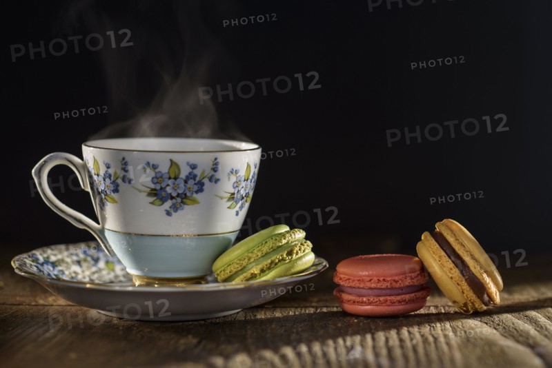 Tea and macaroons on table.