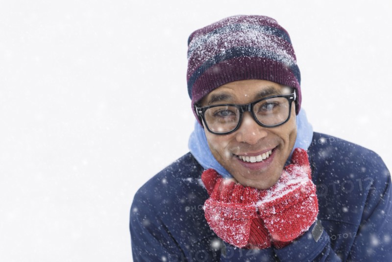 Portrait of mid adult man standing on snow.