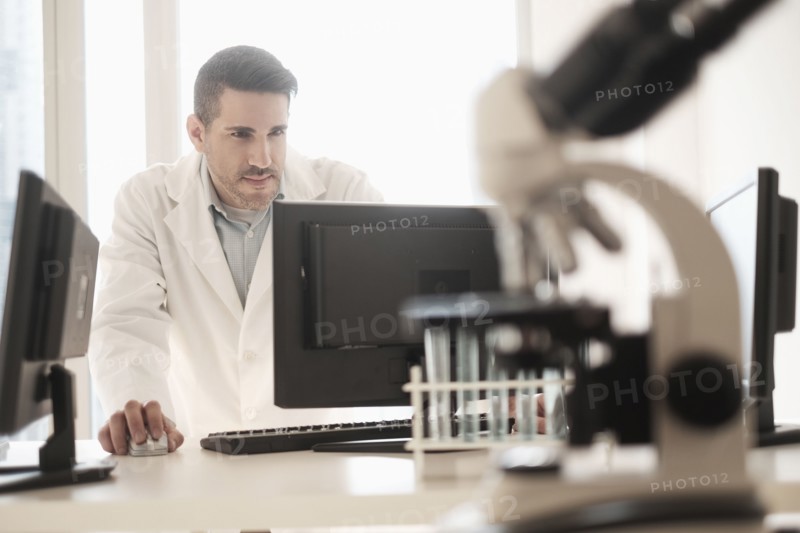 Man using computer in laboratory.