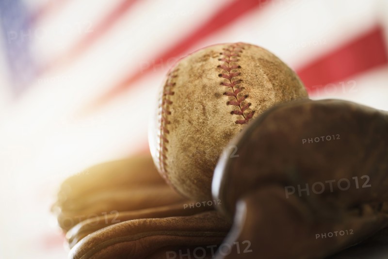 Close-up of baseball glove and ball.
