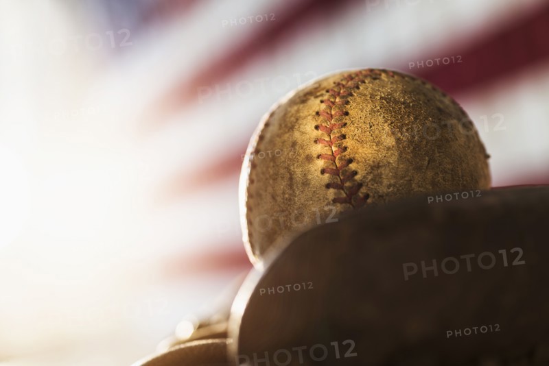 Close-up of baseball glove and ball.