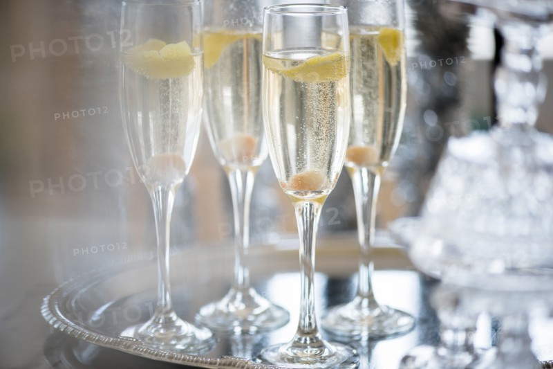 Champagne in champagne flutes on tray