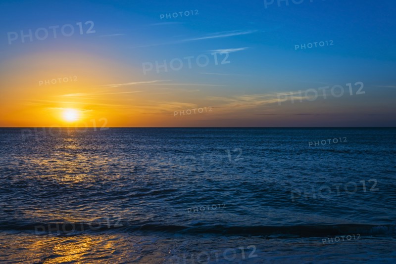 Beach and sea at sunset