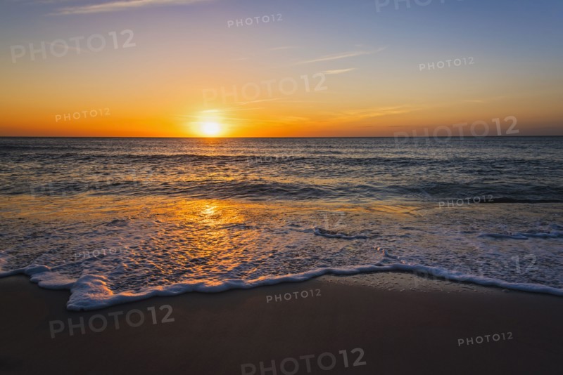 Beach and sea at sunset