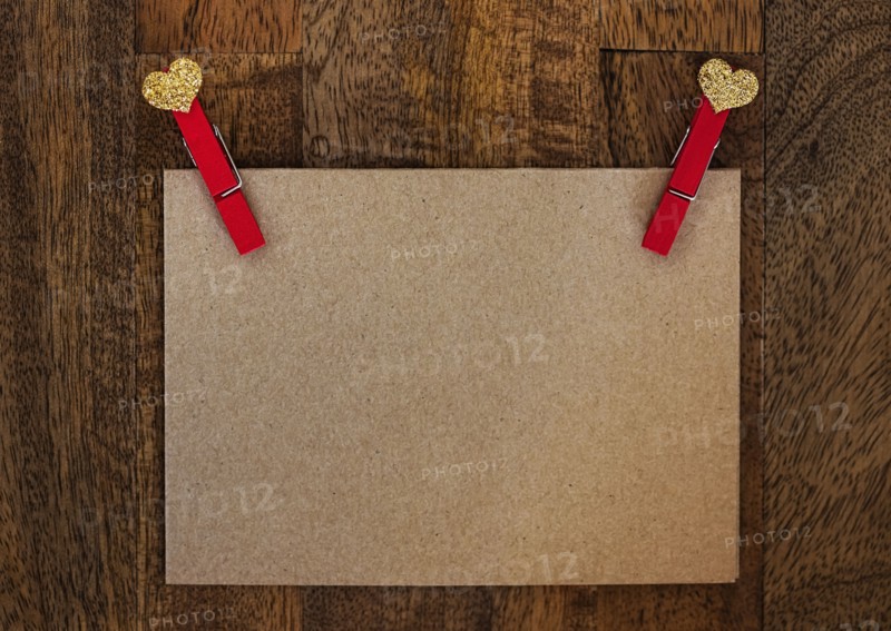 Blank paper with clothespin on wood