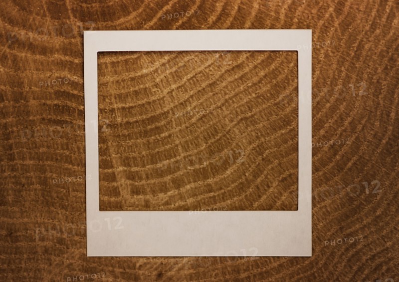 Empty Polaroid frame on wood