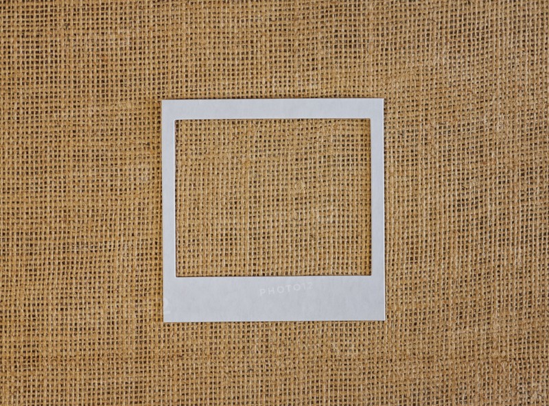 Studio shot of picture frame on fabric
