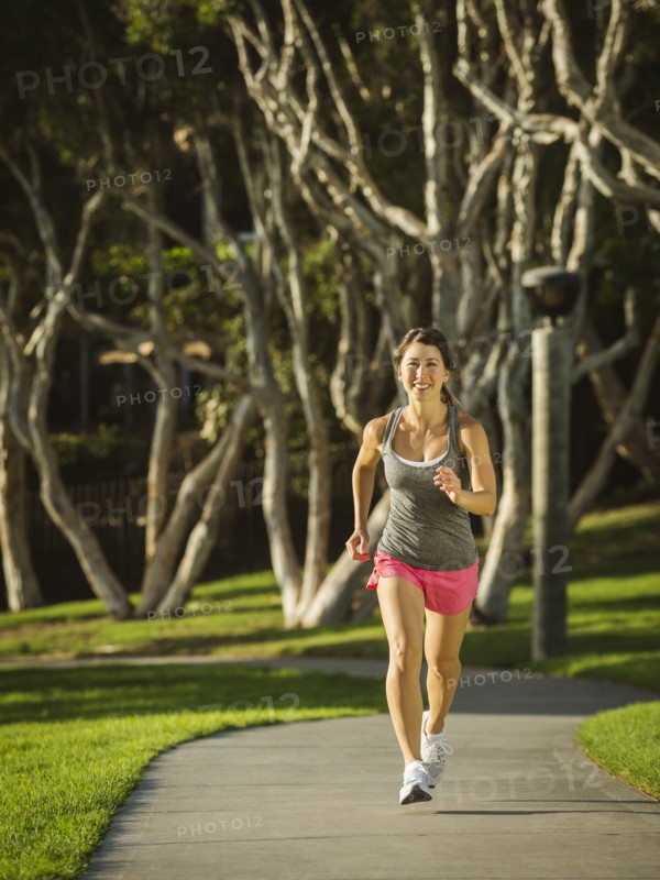 Young woman running in park