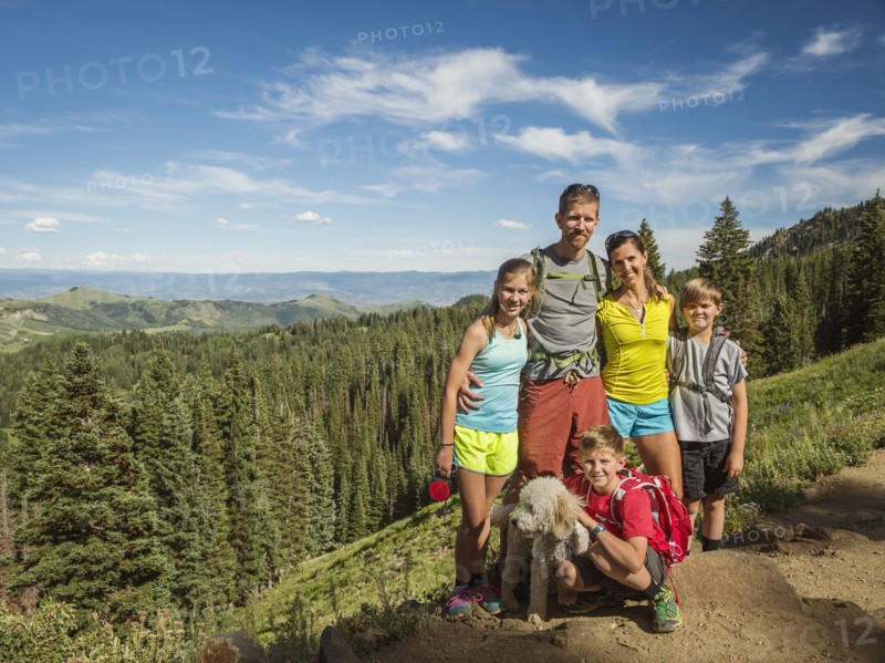 Parents and children (10-11, 12-13, 14-15) with dog