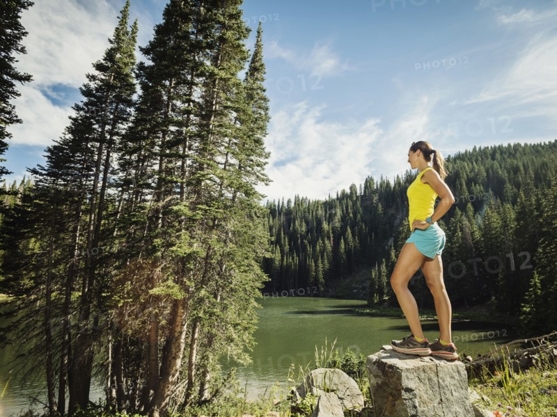 Mature woman standing on rock