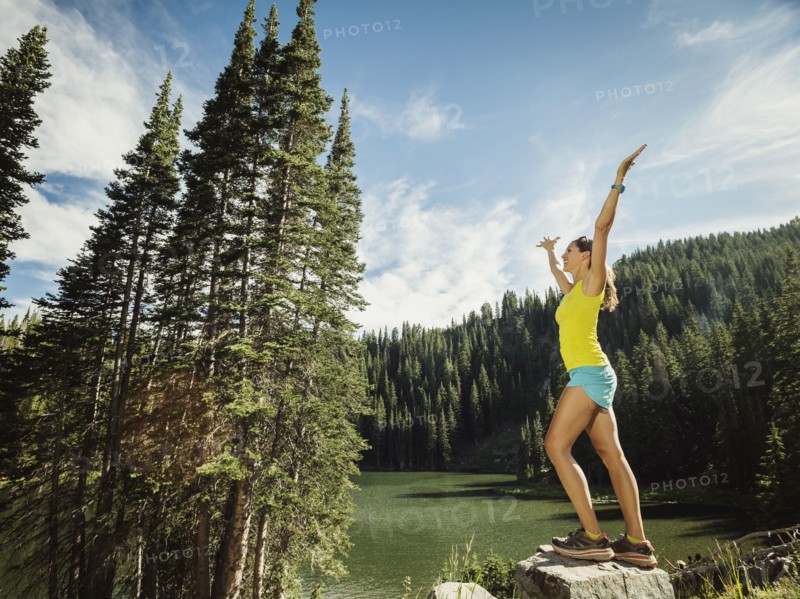 Mature woman standing on rock