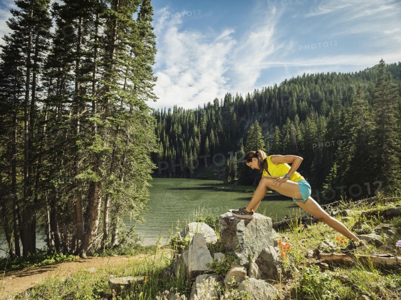 Woman stretching in forest