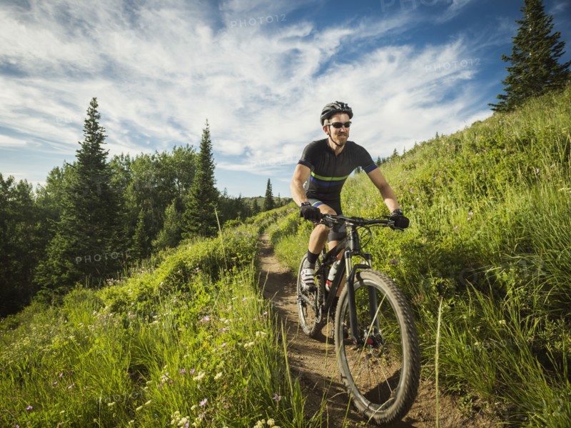 Mature man cycling outdoors