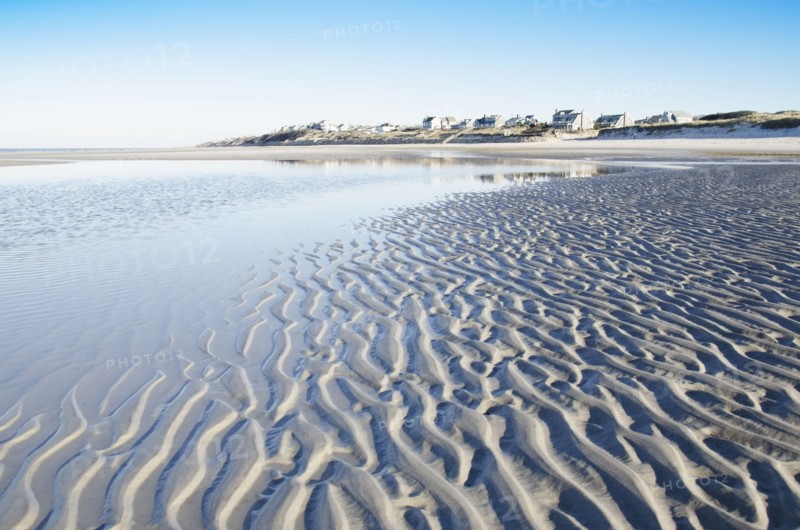 Beach at low tide with rippled sand