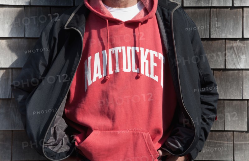 Mature man in hooded sweatshirt and jacket