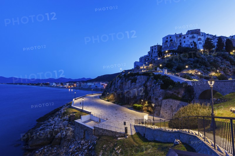 Town on rocky hills at sunrise