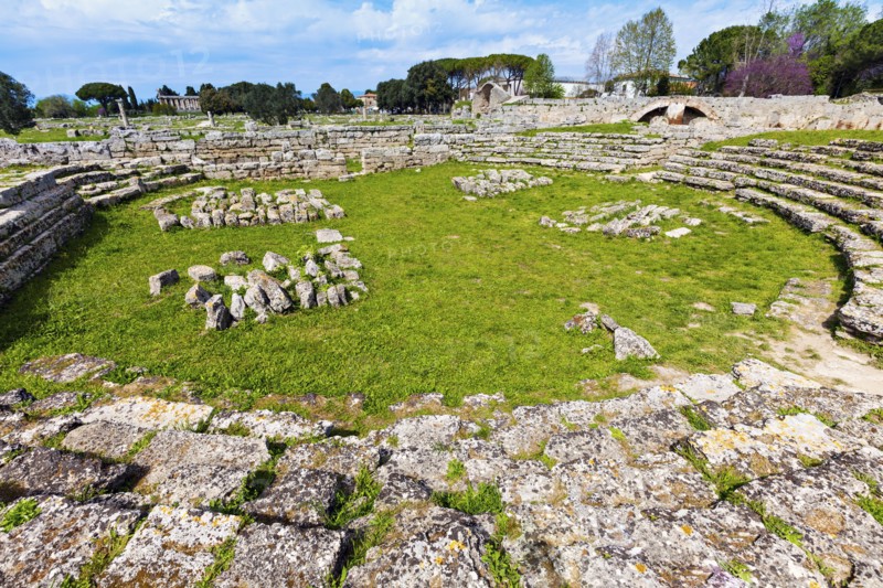 Rocks of Paestum ruins in circle on grass