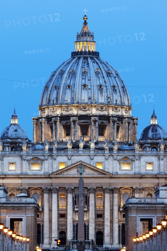Illuminated St. Peter's Basilica at dusk