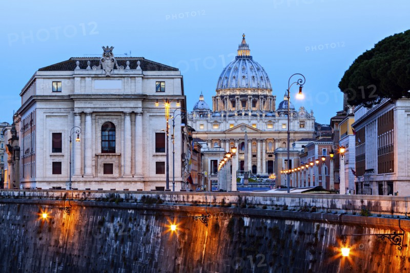 Illuminated St. Peter's Basilica at dusk