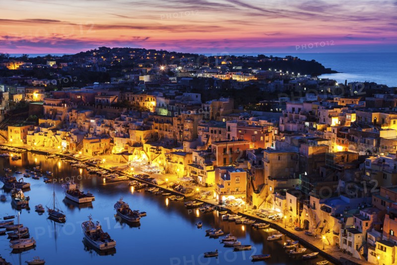 Illuminated townscape on Marina Corricella on Procida Island