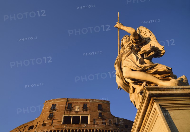 Statue of angel and Castle Sant' Angelo against clear sky