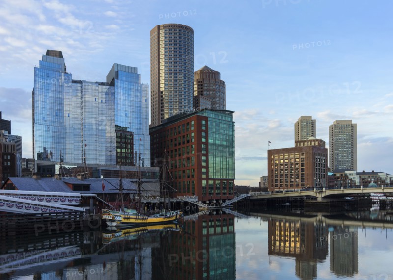 Waterfront buildings reflecting in water