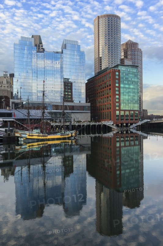 Waterfront buildings reflecting in water