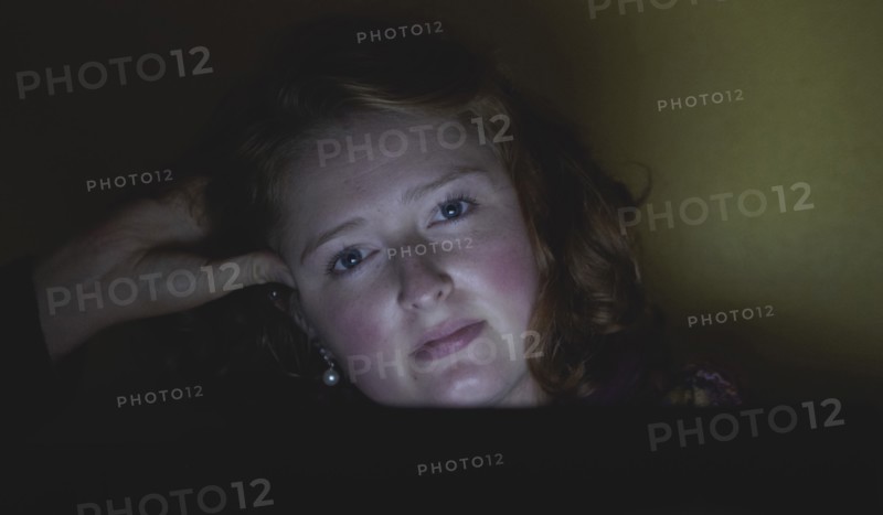 Woman with hand in hair