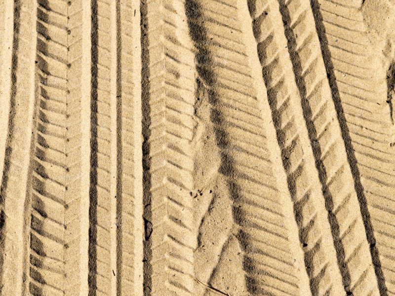 Tire tracks in sand