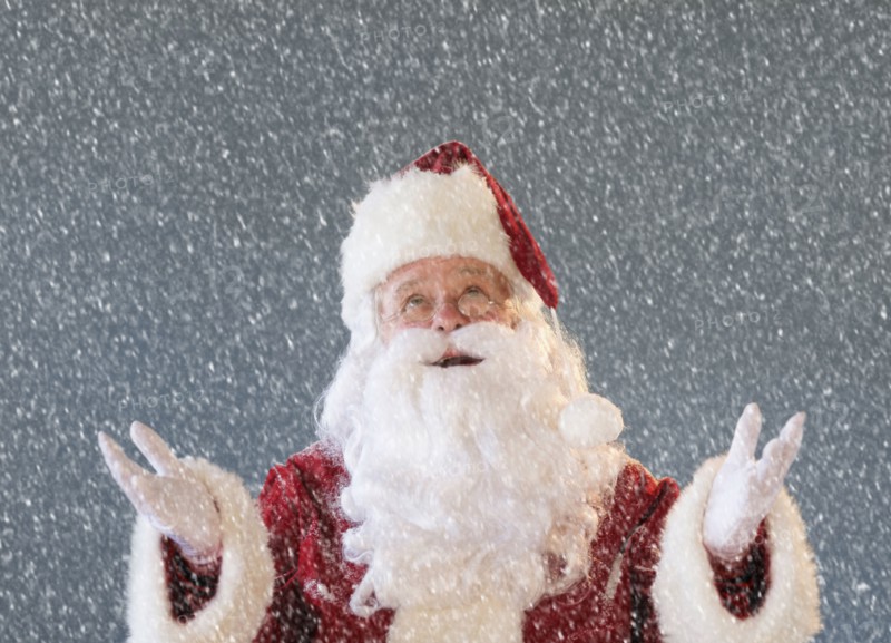 Portrait of Santa Claus looking at snow.