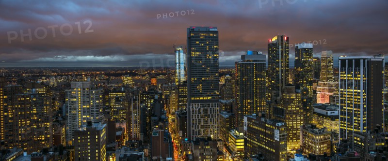 Illuminated cityscape at night. USA, New York, New York City.