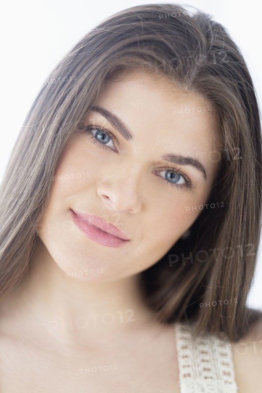 Portrait of young woman with brown hair.