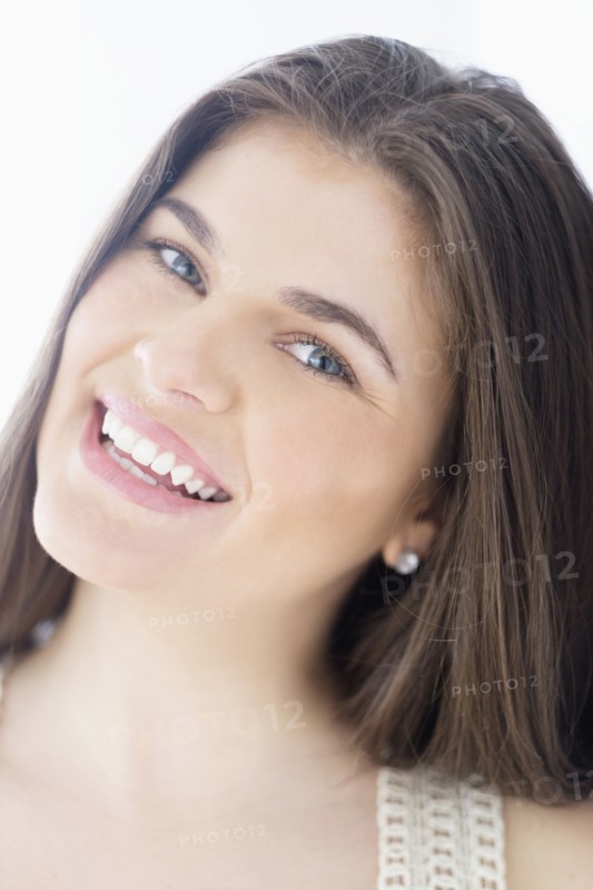 Portrait of young woman with brown hair.