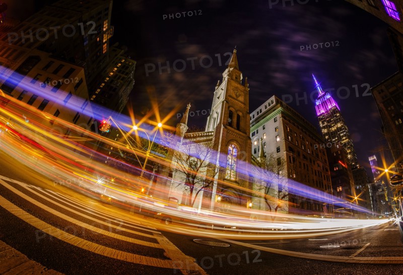 St Bartholomew's Church at night with long exposure of traffic at night. USA, New York, New York City.