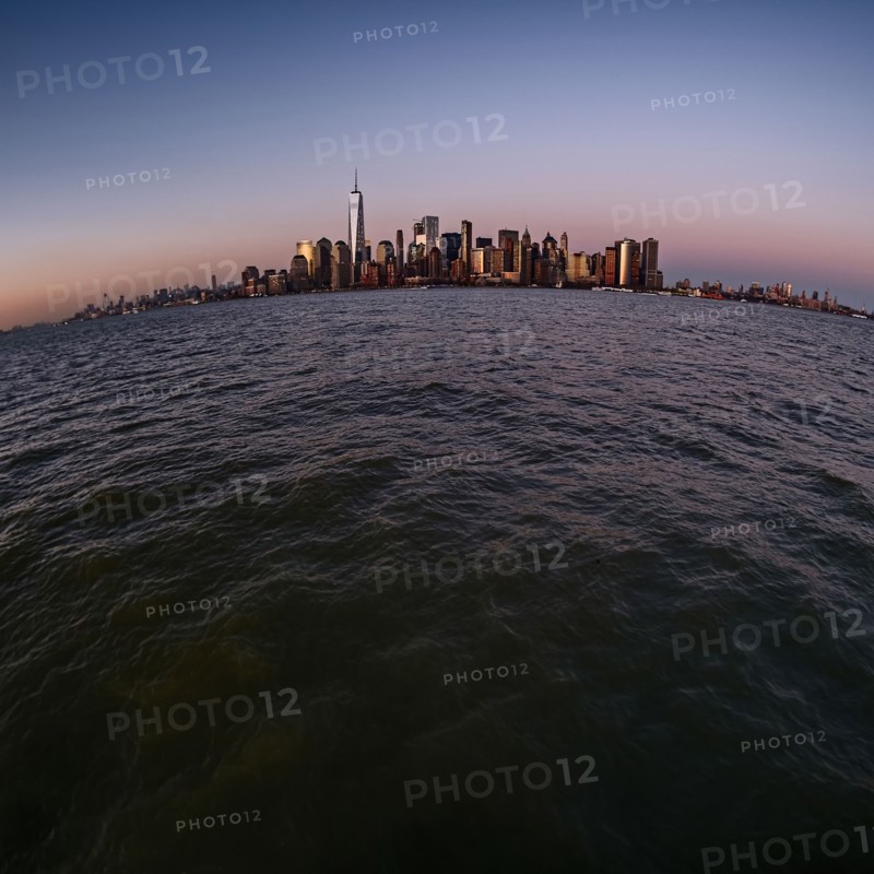 Urban skyline at dusk. USA, New York, New York City.