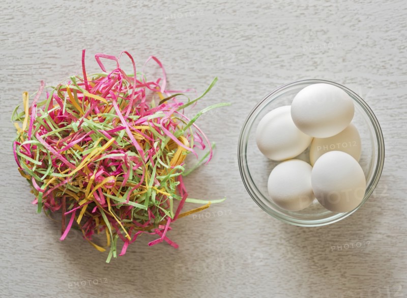 Eggs in bowl and colorful streamers