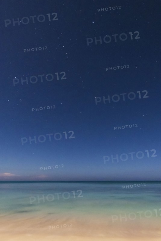 Stars on blue sky over sea