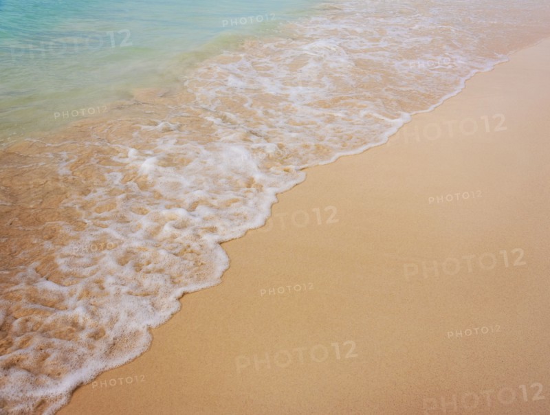 Surf on sandy beach