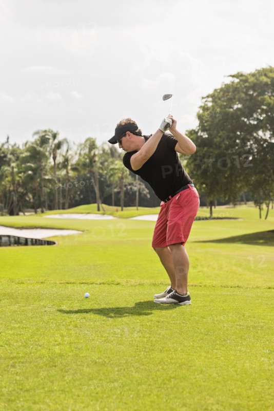Man swinging golf club