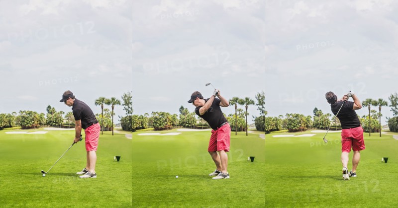 Man hitting ball with golf club